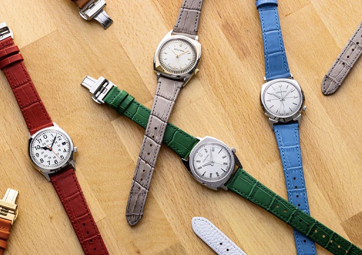 Accutron Legacy Collection Watches Accutron Legacy Collection watches with colorful leather straps arranged on a wooden surface