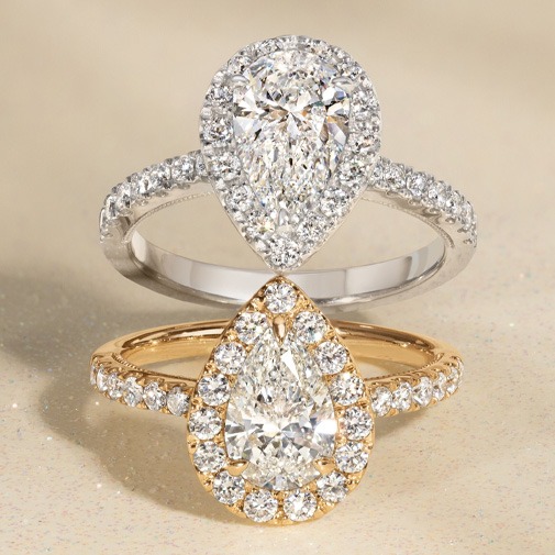 Pear Diamond Band Engagement Ring Style Halo engagement ring with center pear diamond surrounded by a halo of smaller diamonds