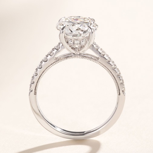 Classic four-prong diamond engagement ring setting Close-up of a round diamond engagement ring secured in a four-prong setting
