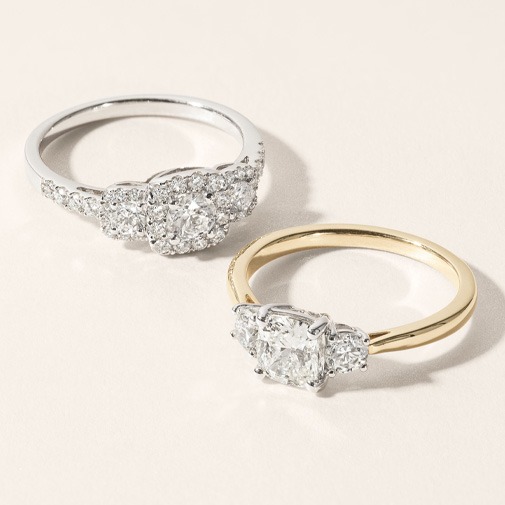 Three Stone Diamond Engagement Ring Symbolizing Past Present and Future Three stone diamond engagement ring with center stone and two side diamonds