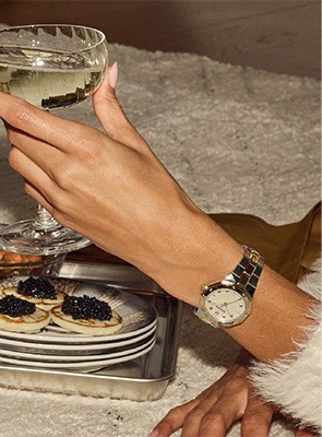 Shop Bulova Classic Watches Bulova Classic gold-tone watch worn on wrist