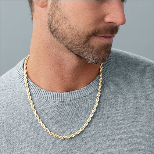 Shop Chains for Men Close up of man wearing a yellow gold rope chain