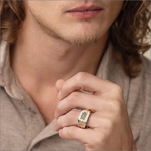 Shop Desert Diamonds for Men Close up of man wearing a two-tone ring with champagne diamonds