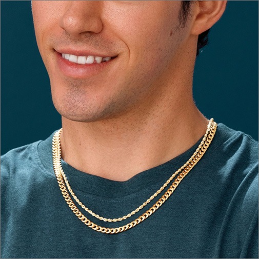 Shop Gold Jewelry for Men Close up of man wearing a yellow gold rope chain and yellow gold cuban chain